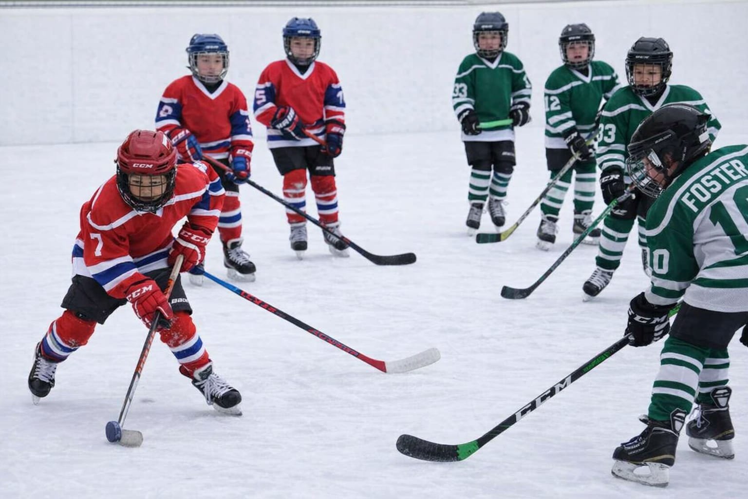 Youth hockey athletes training on the ice
